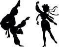 Ukrainian national dance hopak. A girl and a guy are dancing a dance in national Ukrainian costumes. Silhouette.